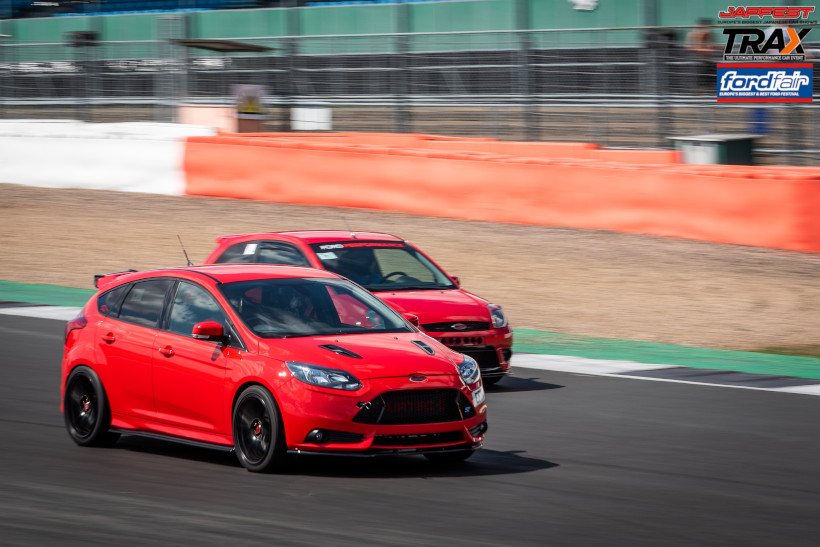 Two cars side by side on track at Silverstone
