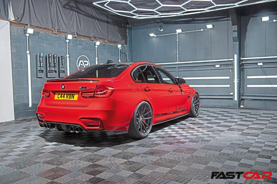 rear 3/4 shot of modified bmw f80 m3