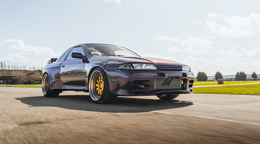 A modified Nissan Skyline R32 in motion.