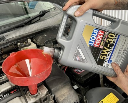 adding engine oil to a Ford engine