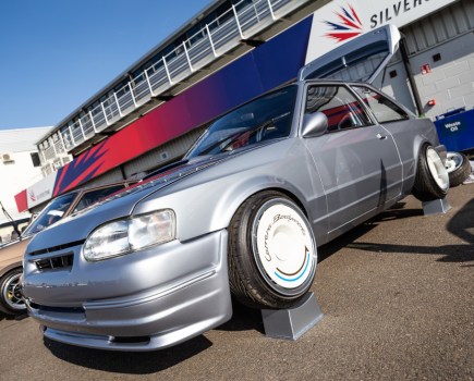 exciting low shot of a car at a car show